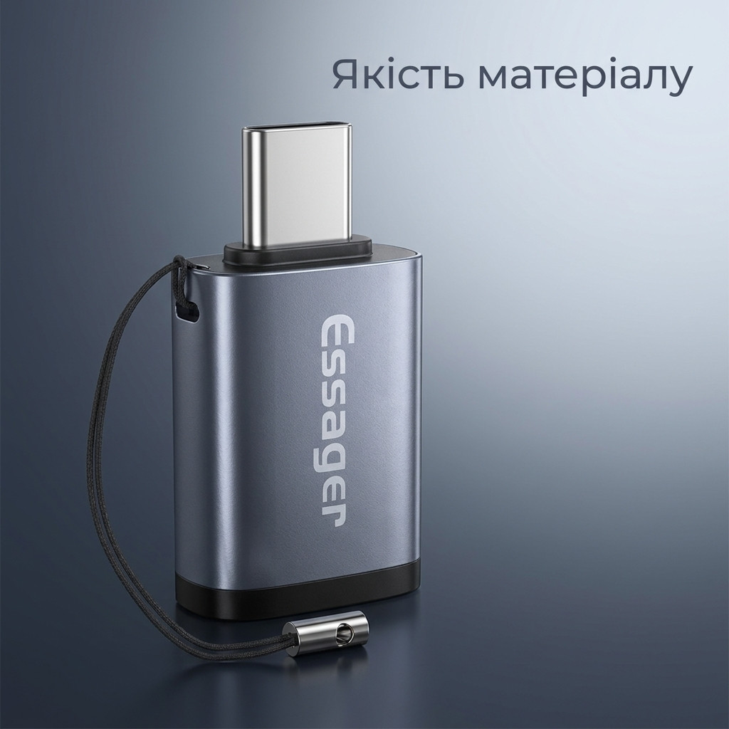 Перехідник Essager OTG поруч із смартфоном на столі, вигляд згори